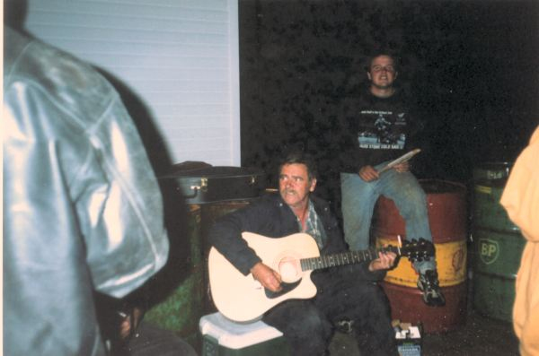 600: Red Island. Leonard Mulrooney Sr. and Leonard Jr. at a party on the government wharf. (2002)  [courtesy of Heather Walsh]